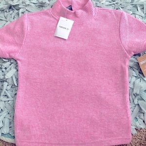 I am selling this pink high crew neck T i got for my birthday.